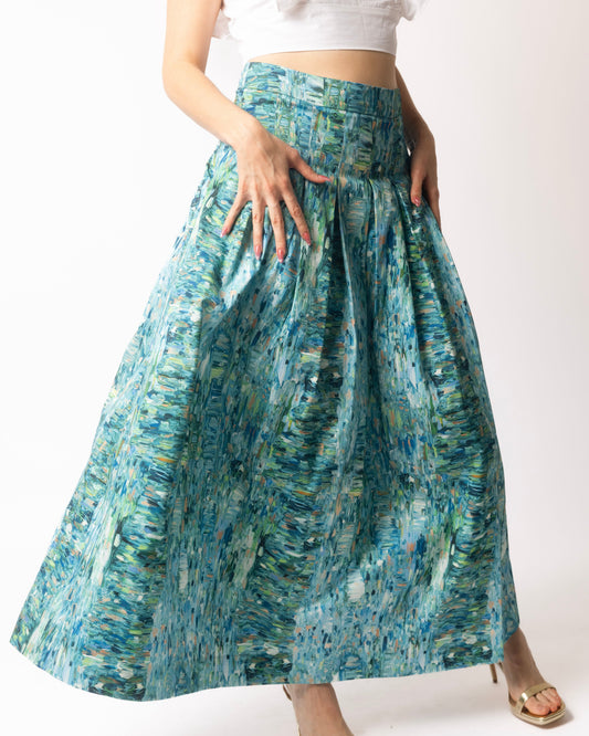 Woman wearing a blue patterned skirt on a white background