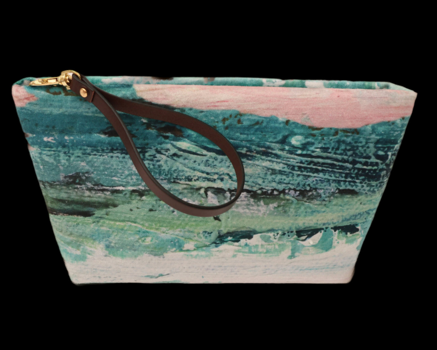 Pouch with a textured surface and brown strap on a black background