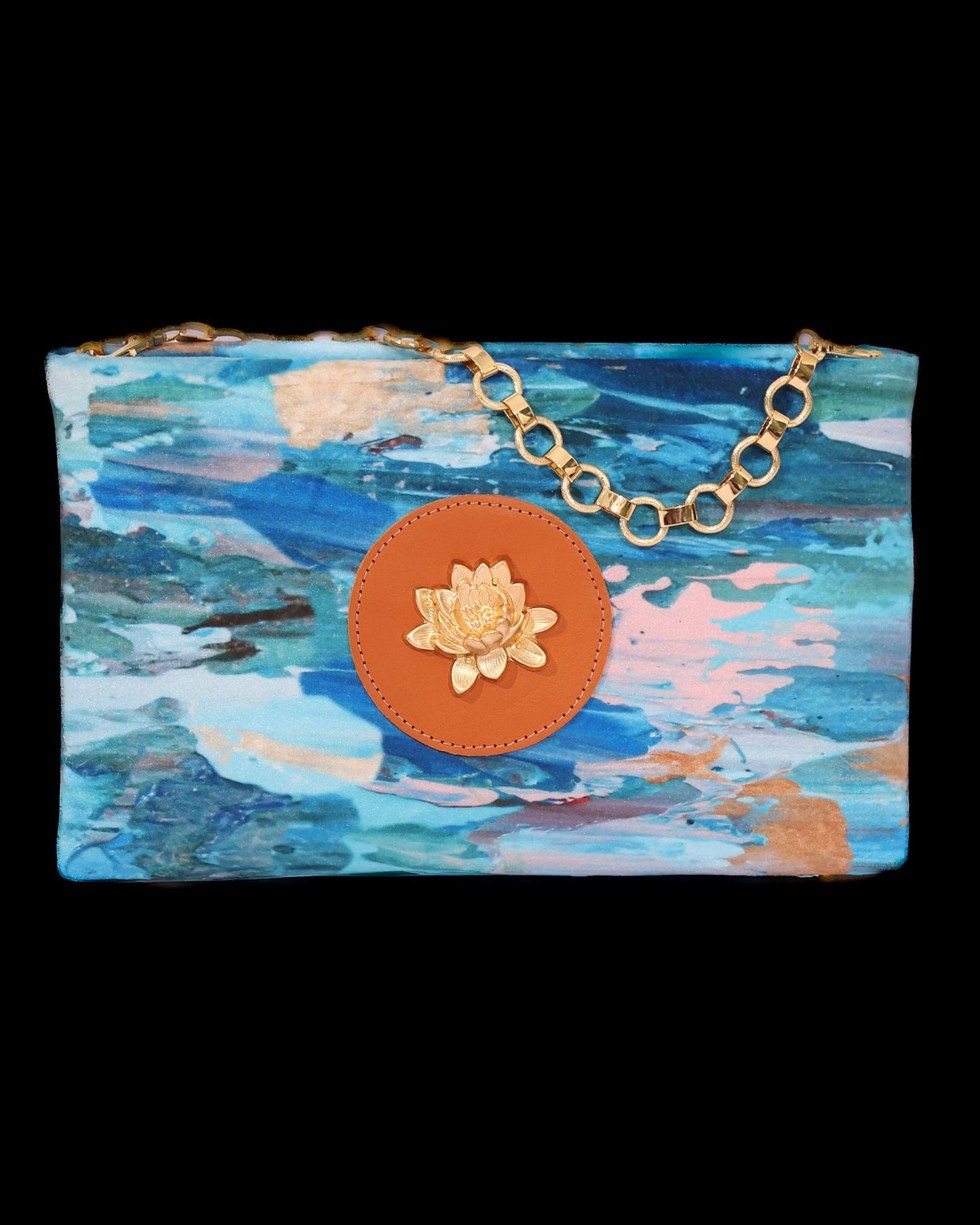 Small clutch with a floral design and lotus brass accent on brass chain
