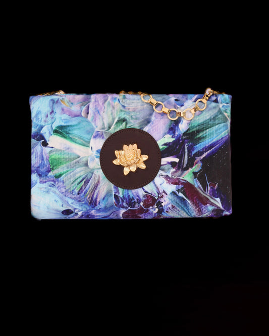 Floral patterned clutch with lotus brass accent