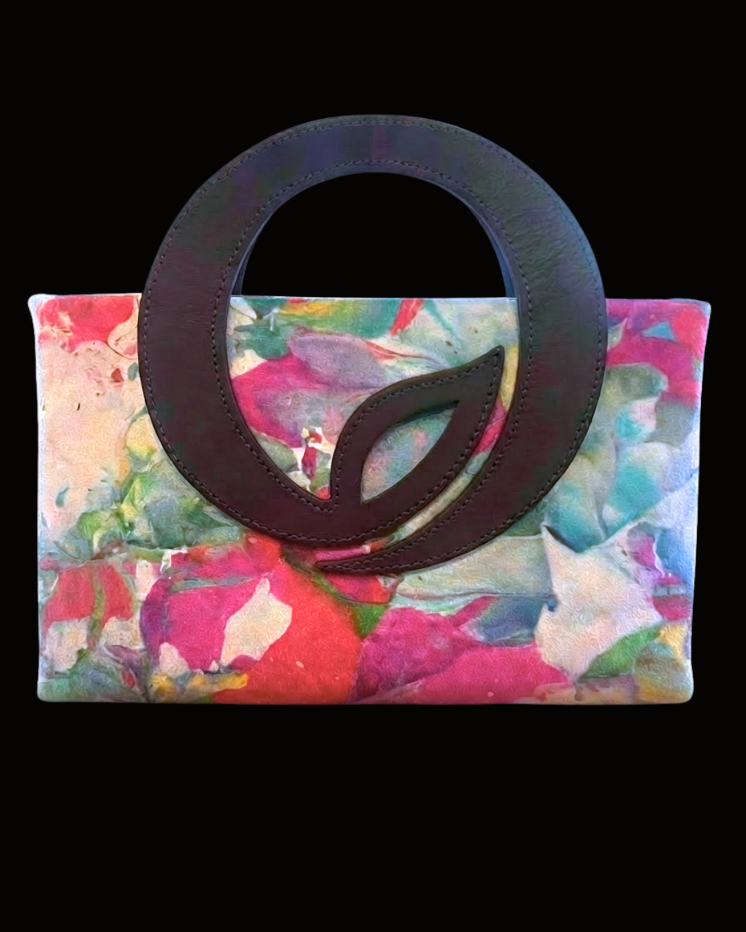 Colorful floral-patterned clutch with a dark brown circular design on a black background